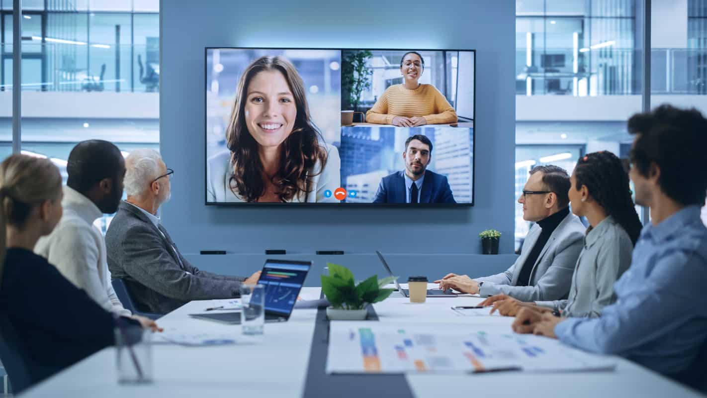 Meeting room with people and LED display