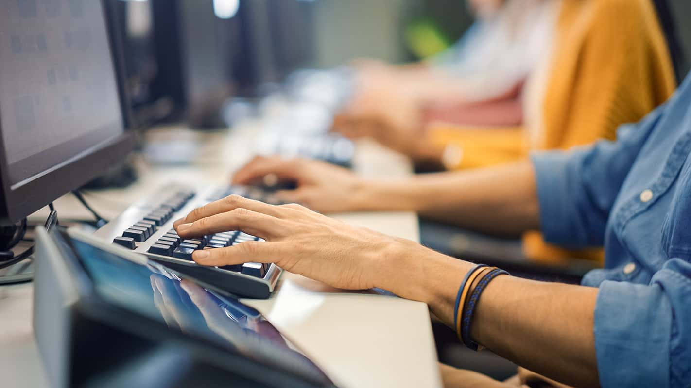 Office Team of Technical Support Staff Members Work on Computers