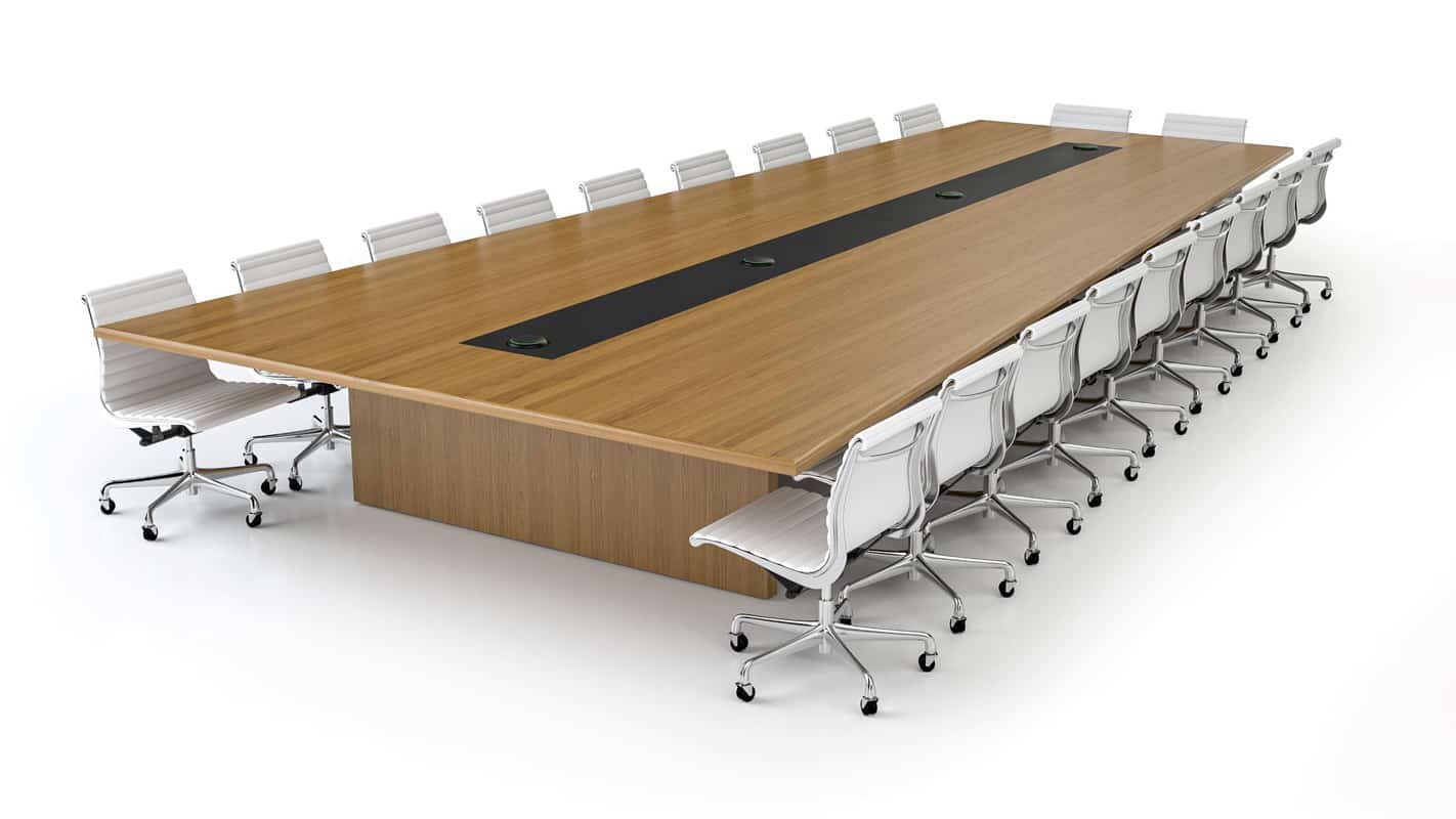 Modern conference table with white chairs on white background.